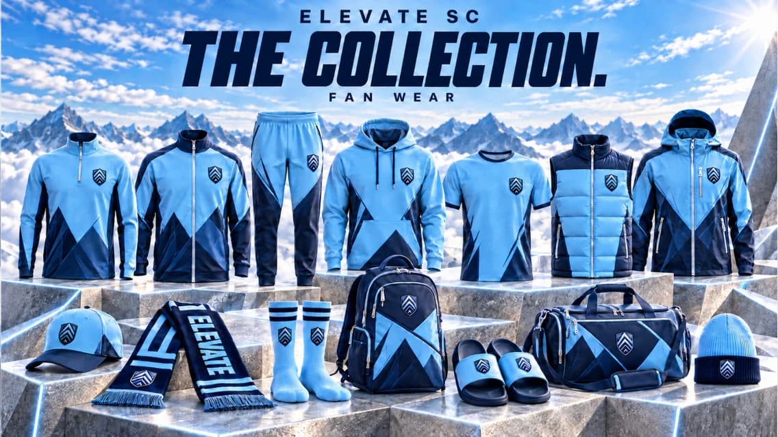 The Elevate SC fan wear collection in sky blue and navy: jackets, quarter-zip, hoodie, tee, vest, track pants, cap, scarf, socks, backpack, slides, duffel bag and beanie.